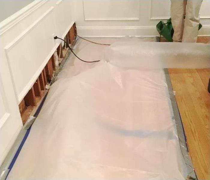 containment to wood floors to control drying time during property restoration