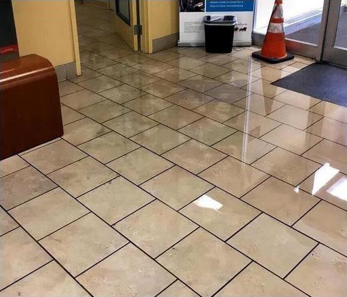 Water soaked commercial floor and contents after a heavy rain and flooding
