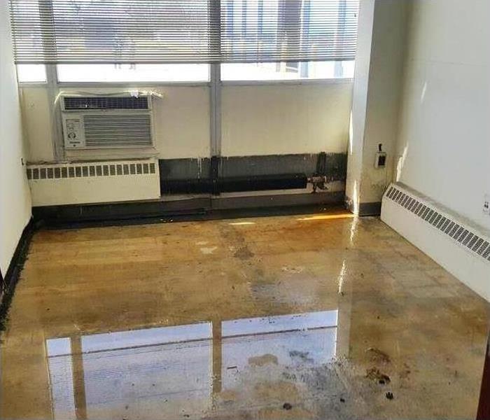 commercial building office with visible flooding and water damage